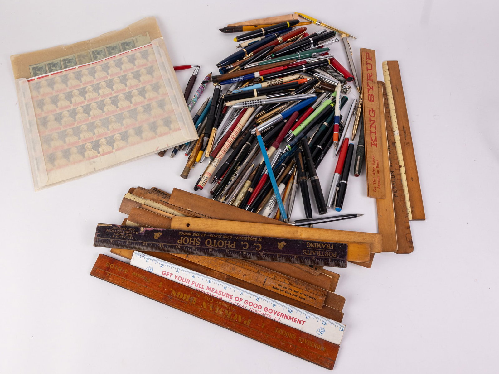 Vintage Desk Supplies and Collectible Stamps: Vintage advertising rulers - vintage pens and pencils - assorted vintage stamps Literature Brooks Auction – Online Auction Terms & Conditions Contact: (856) 694-2960 | info@brooks.auction READ B