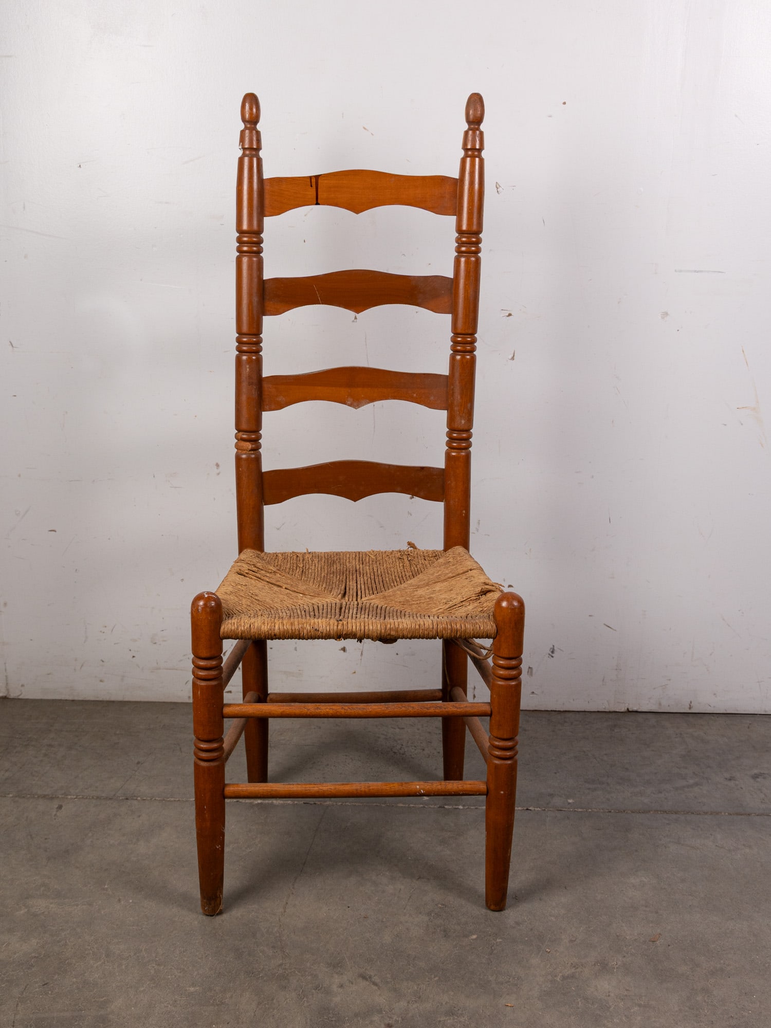 Ladderback Chair: Ladderback Chair - some wear with age Size 44" x 14" x 18" Literature Brooks Auction – Online Auction Terms & Conditions Contact: (856) 694-2960 | info@brooks.auction READ BEFORE YOU BID: We