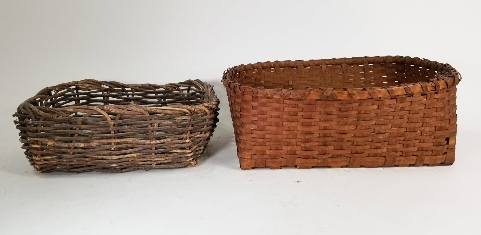 Assorted Primitive Antique Baskets Featuring Oak Splint: Assorted Primitive Antique Baskets Featuring Oak Splint Size 6" x 18" x 13" Literature Brooks Auction – Online Auction Terms & Conditions Contact: (856) 694-2960 | info@brooks.auction READ