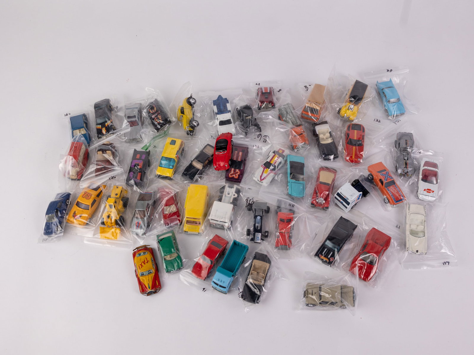 Assorted Vintage Die Cast Miniature Toy Cars Featuring Hotwheels: Assorted Vintage Die Cast Miniature Toy Cars Featuring Hotwheels Size 7" x 12" x 12" Literature Brooks Auction – Online Auction Terms & Conditions Contact: (856) 694-2960 | info@brooks.auction