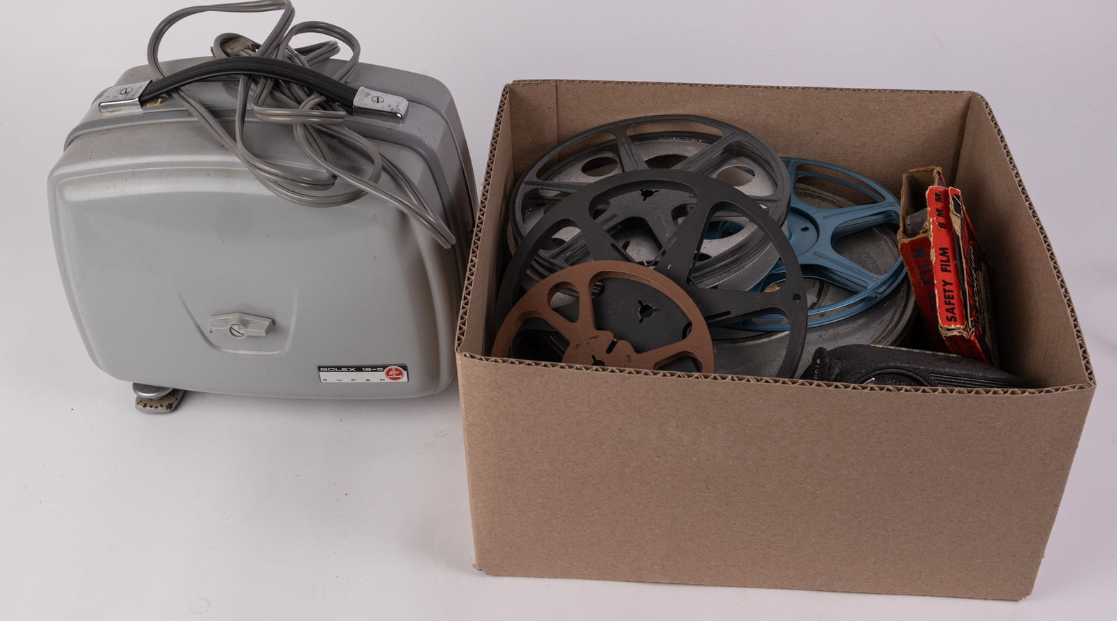 Assorted Vintage Cameras, Projectors, and Film Reels: Assorted Vintage Cameras, Projectors, and Film Reels Literature Brooks Auction – Online Auction Terms & Conditions Contact: (856) 694-2960 | info@brooks.auction READ BEFORE YOU BID: We want you