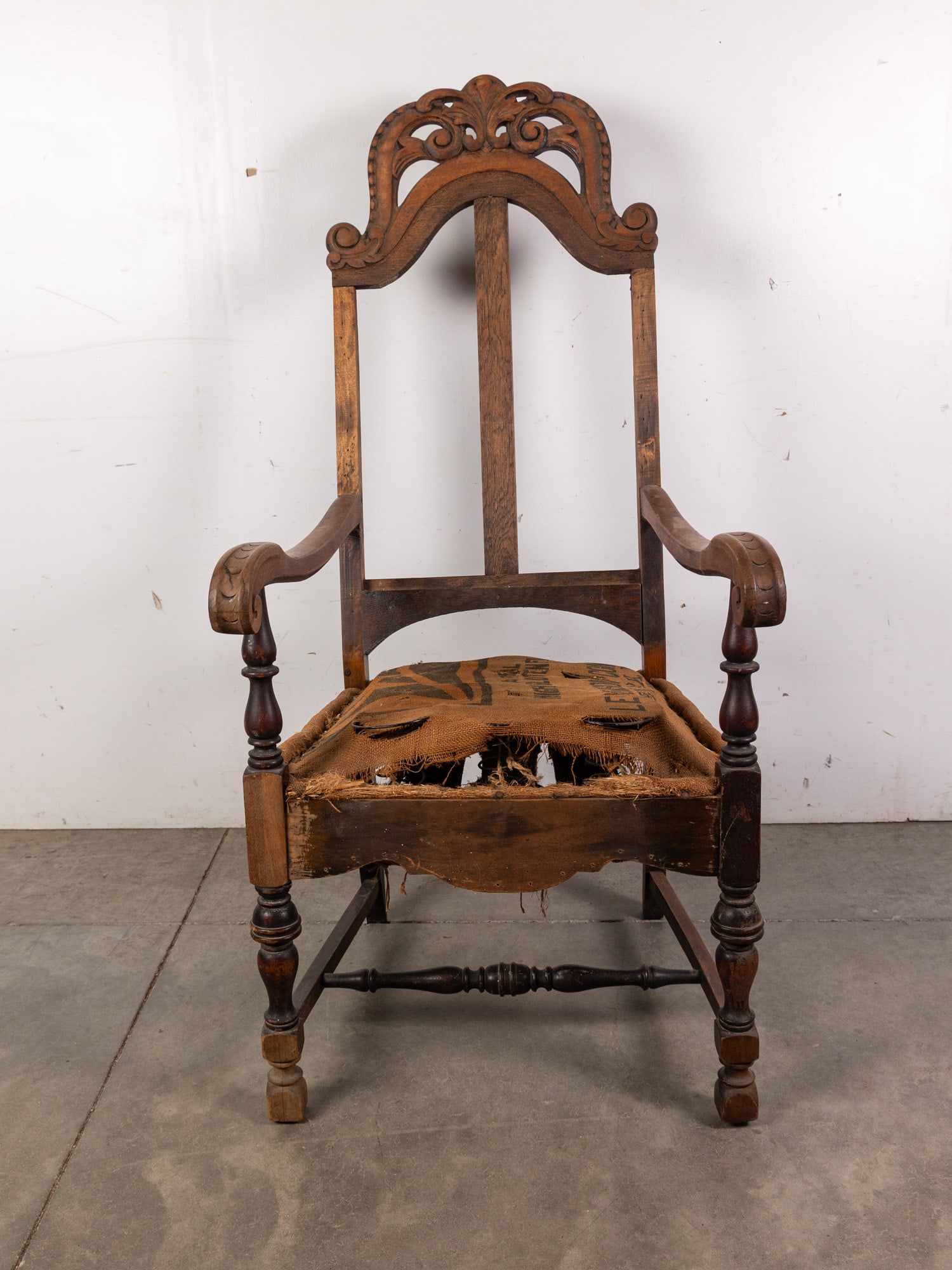 Antique Carved Armchair: Antique Carved Armchair - frame is in great condition, damaged burlap sack seat Size 52" x 32" x 24" Literature Brooks Auction – Online Auction Terms & Conditions Contact: (856) 694-2960 | info
