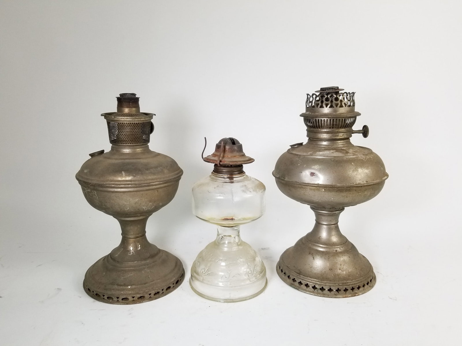 Three Kerosene Oil Lamp Bases: Three (3) Kerosene Oil Lamp Bases Size 12" H Literature Brooks Auction – Online Auction Terms & Conditions Contact: (856) 694-2960 | info@brooks.auction READ BEFORE YOU BID: We want you to feel