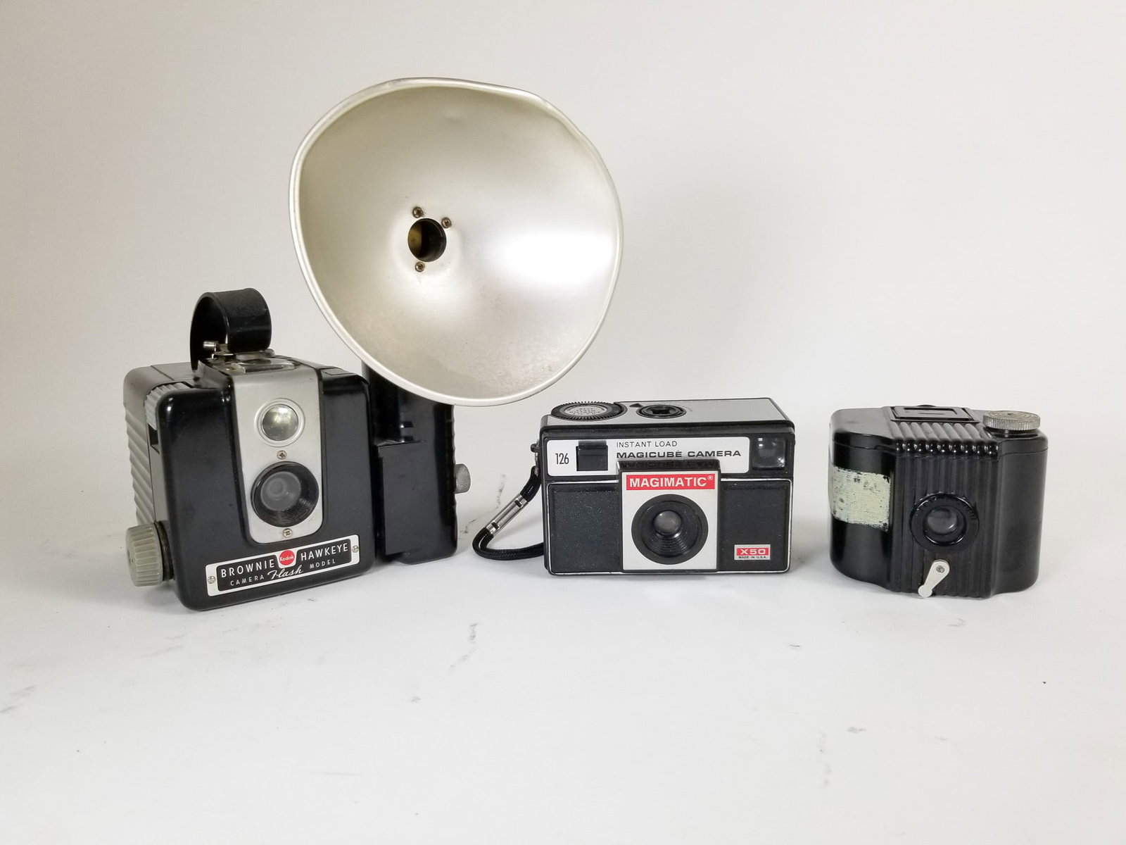 Three Vintage Cameras: Three (3) Vintage Cameras Size 7" x 12" x 12" Literature Brooks Auction – Online Auction Terms & Conditions Contact: (856) 694-2960 | info@brooks.auction READ BEFORE YOU BID: We want you to