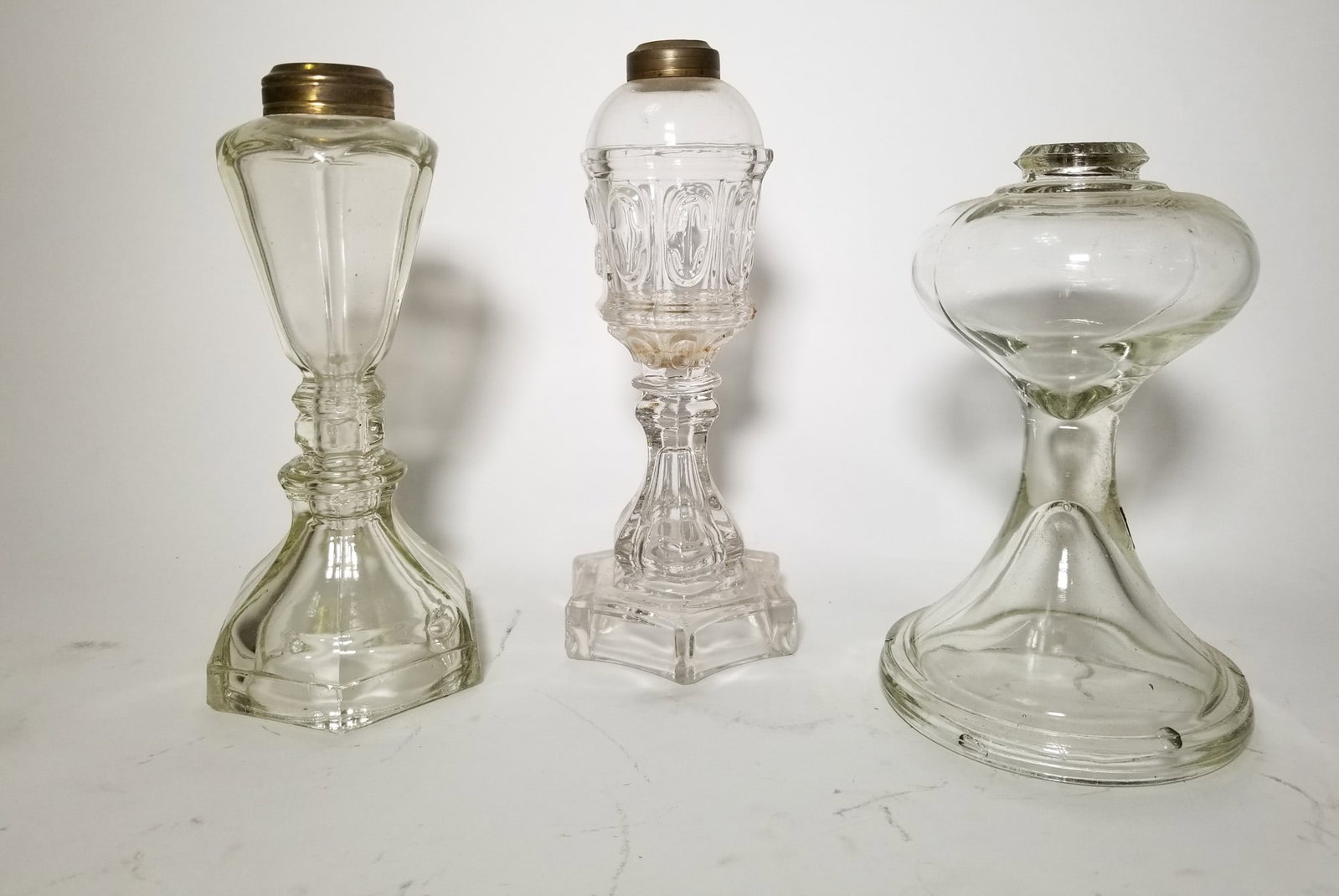 Three Kerosene Oil Lamp Bases: Three (3) Kerosene Oil Lamp Bases Size 7"x 12" x 12" Literature Brooks Auction – Online Auction Terms & Conditions Contact: (856) 694-2960 | info@brooks.auction READ BEFORE YOU BID: We want you