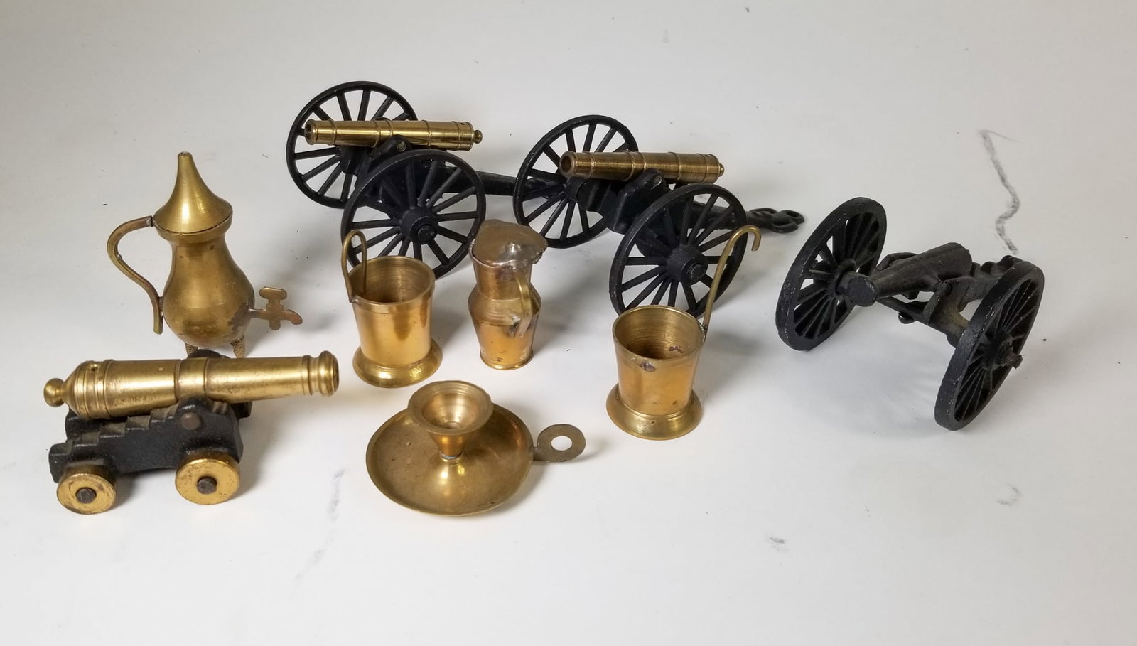 Assortment of Small Cast Iron & Brass Objects: Assortment of Small Cast Iron & Brass Objects Size 7" x 12" x 12" Literature Brooks Auction – Online Auction Terms & Conditions Contact: (856) 694-2960 | info@brooks.auction READ BEFORE YOU