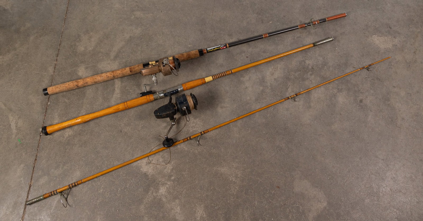 Three Fishing Rods: Three (3) Fishing Rods, two (2) have reels Size 62" H Literature Brooks Auction – Online Auction Terms & Conditions Contact: (856) 694-2960 | info@brooks.auction READ BEFORE YOU BID: We want
