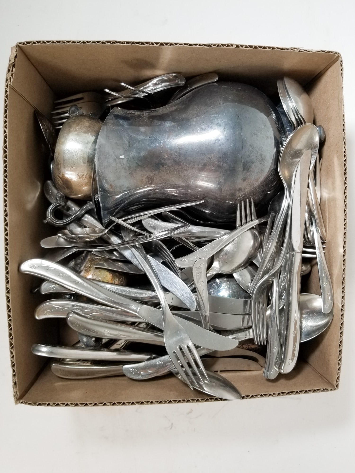 Assortment Stainless and Silver-Plated Items: Assortment Stainless and Silver-Plated Items Size 7" x 12" x 12" Literature Brooks Auction – Online Auction Terms & Conditions Contact: (856) 694-2960 | info@brooks.auction READ BEFORE YOU BID: