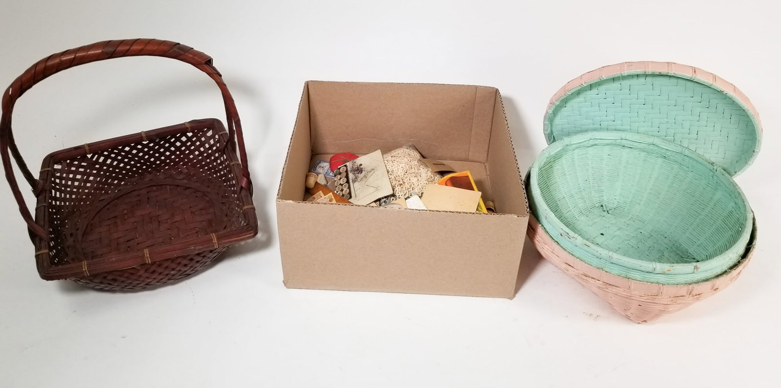 Two Wicker Baskets & Assortment of Sewing Tools: Two Wicker Baskets & Assortment of Sewing Tools Size 7" x 12" x 12" Literature Brooks Auction – Online Auction Terms & Conditions Contact: (856) 694-2960 | info@brooks.auction READ BEFORE YOU