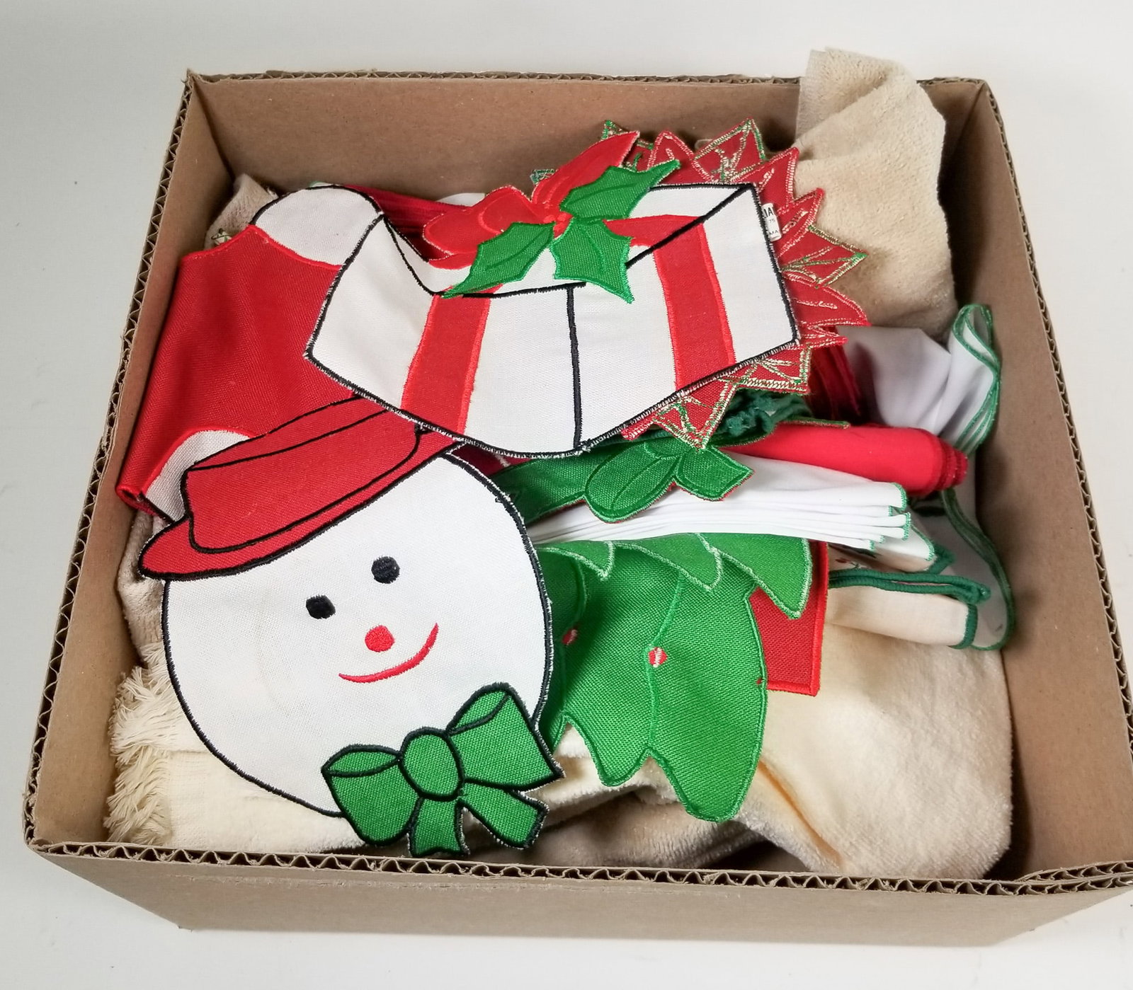 Assortment of Christmas Towels & Quilting Patches: Assortment of Christmas Towels & Quilting Patches Size 7" x 12" x 12" Literature Brooks Auction – Online Auction Terms & Conditions Contact: (856) 694-2960 | info@brooks.auction READ BEFORE YOU