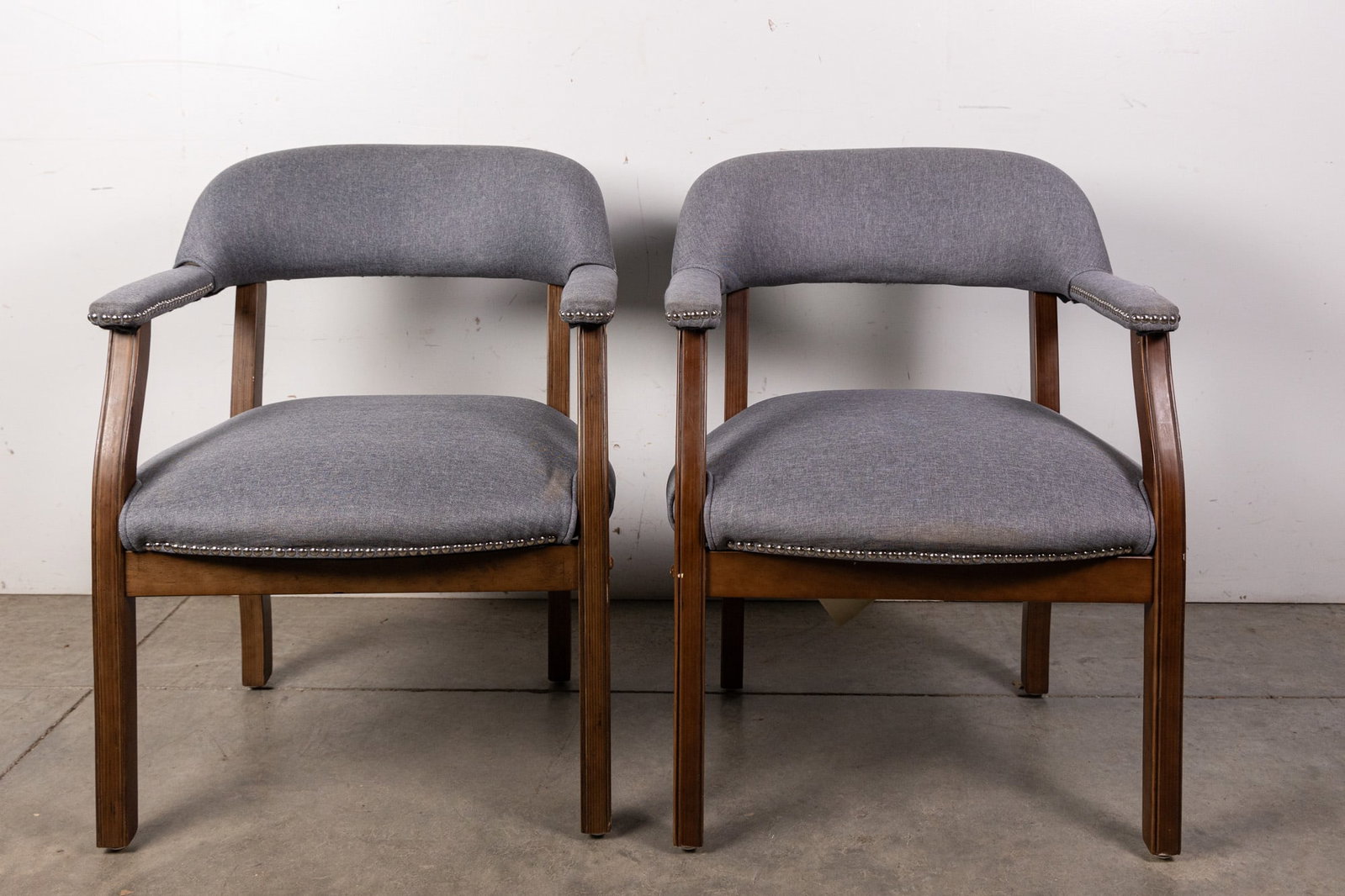 Two Contemporary Arm Chairs with Brass Tack Accents: Two Contemporary Arm Chairs with Brass Tack Accents Size 31" H Literature Brooks Auction – Online Auction Terms & Conditions Contact: (856) 694-2960 | info@brooks.auction READ BEFORE YOU BID: