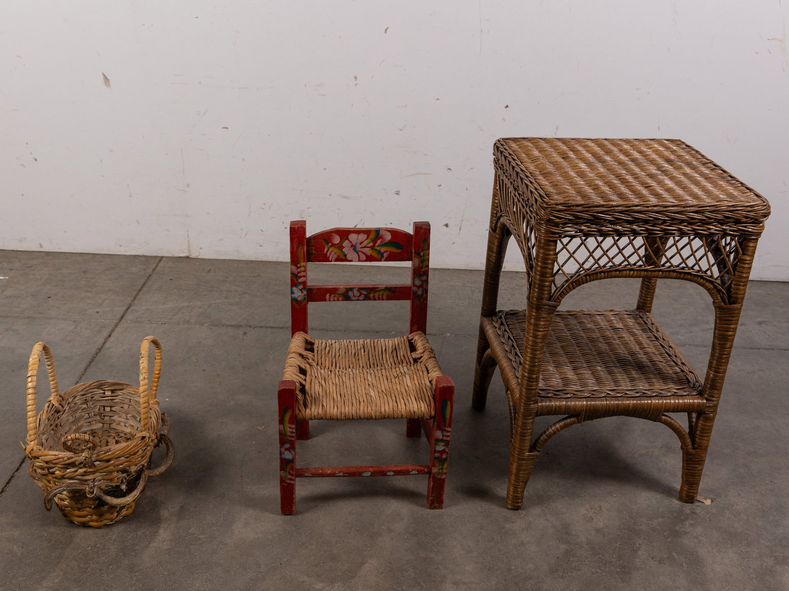 Three Pieces of Wicker Decor: Three (3) Pieces of Wicker Decor Size 21" x 13" x 13" Literature Brooks Auction – Online Auction Terms & Conditions Contact: (856) 694-2960 | info@brooks.auction READ BEFORE YOU BID: We want
