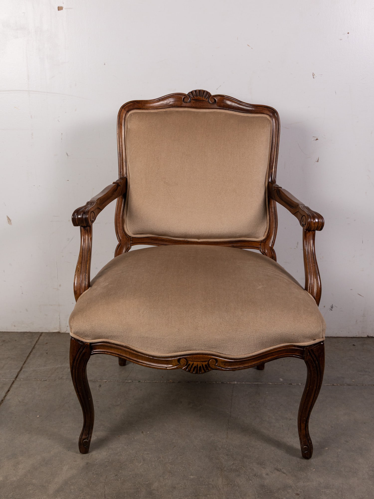 French Regency-Style Armchair with Cream Upholstery and Cabriole Legs: French Regency-Style Armchair with Cream Upholstery and Cabriole Legs Size 36" x 25" x 20" Literature Brooks Auction – Online Auction Terms & Conditions Contact: (856) 694-2960 | info@brooks.au
