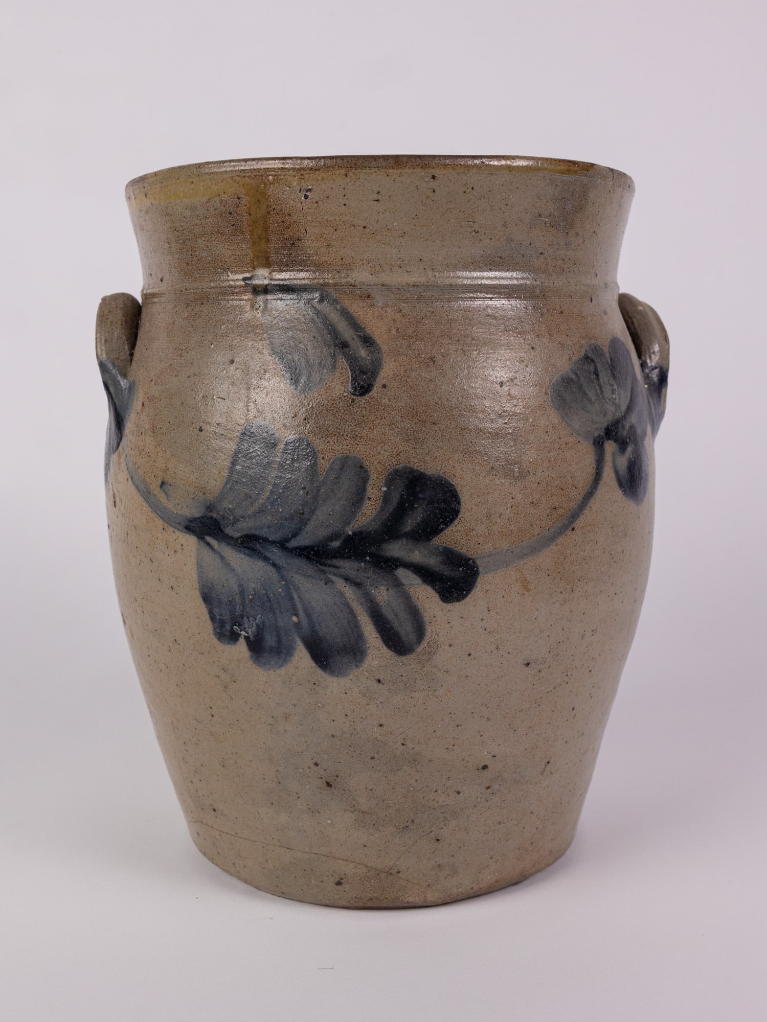Cobalt Decorated Salt Glazed Stoneware Crock: Some minor hairline cracks near base. Size 9" x 8" diameter Literature Brooks Auction – Online Auction Terms & Conditions Contact: (856) 694-2960 | info@brooks.auction READ BEFORE YOU BID: We