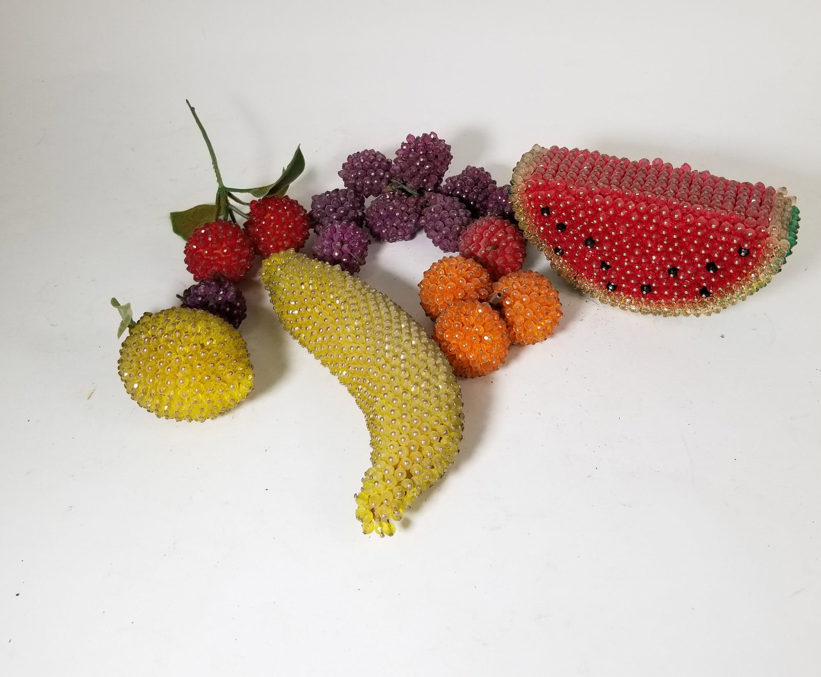 Grouping of Vintage Faux Decorative Fruit: Grouping of Vintage Faux Decorative Fruit Size 7" x 12" x 12" Literature Brooks Auction – Online Auction Terms & Conditions Contact: (856) 694-2960 | info@brooks.auction READ BEFORE YOU BID: We