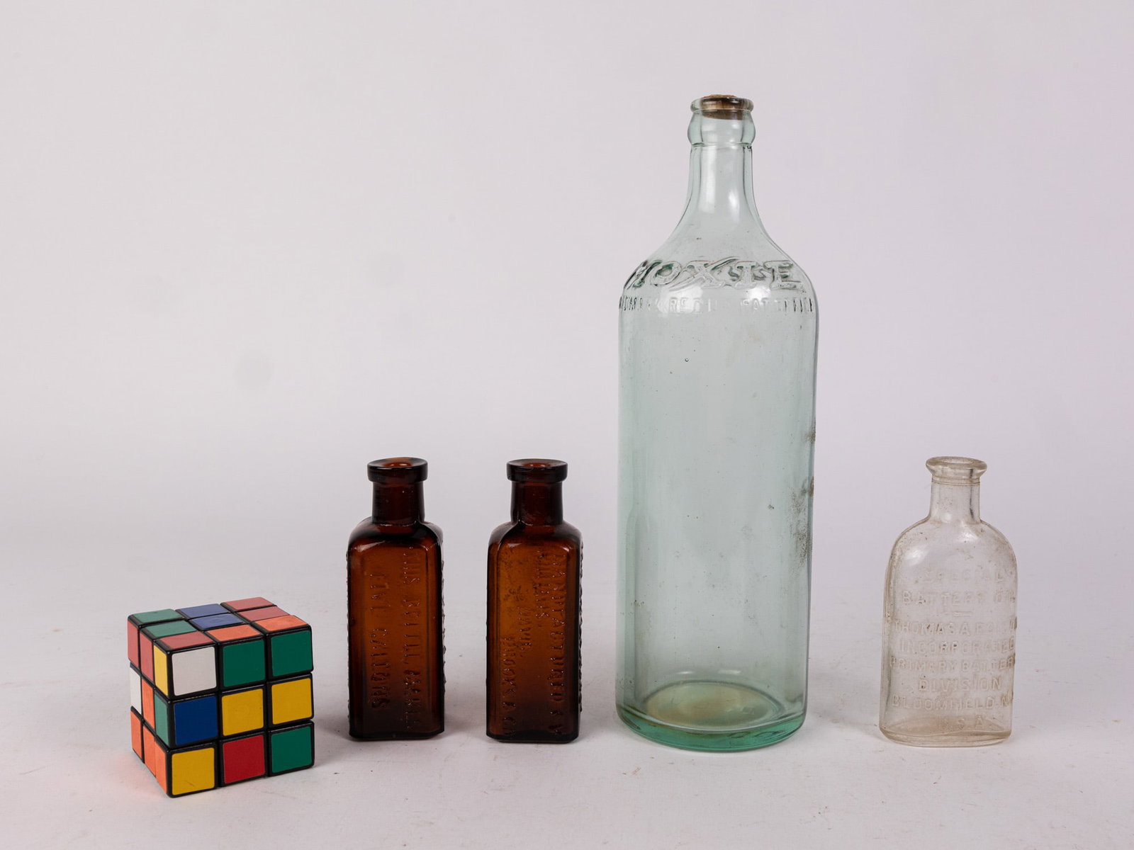 Four Embossed Glass Bottles ft. Thomas Edison Battery Oil - 2