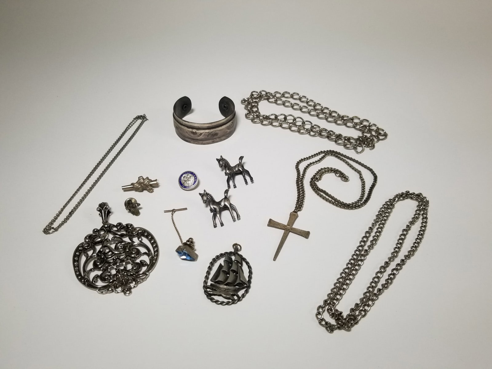 Assortment of Silver-Tone and Sterling Jewelry ft. Sterling Crucifix Pendant: Assortment of Silver-Tone and Sterling Jewelry ft. Sterling Crucifix Pendant Literature Brooks Auction – Online Auction Terms & Conditions Contact: (856) 694-2960 | info@brooks.auction READ