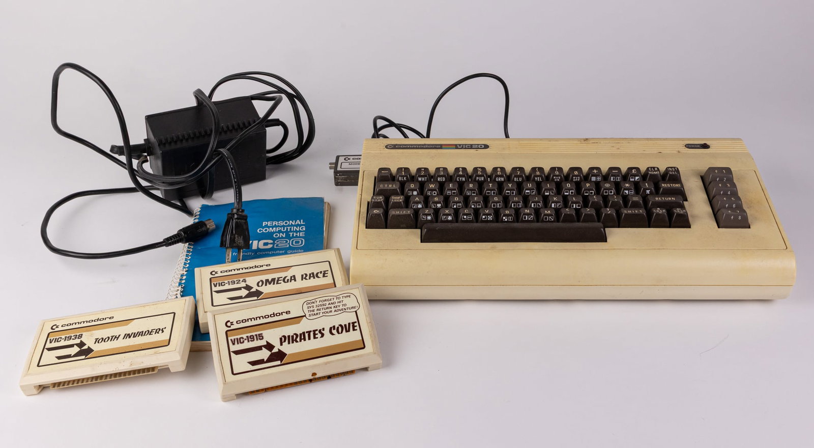 Vintage Commodore 64 System ft. Three Games: Own a piece of retro computer history with the Commodore 64 System. Size 7" x 12" x 12" Literature Brooks Auction – Online Auction Terms & Conditions Contact: (856) 694-2960 | info@brooks.aucti