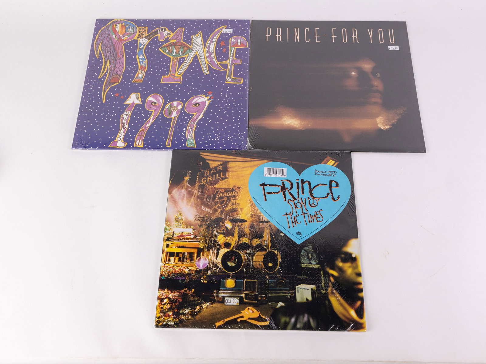 Three Prince Vinyl Records in Original Packaging: Lot includes Prince for You, Sign of the Times, and 1999, all in original plastic. Size 12" x 12" Literature Brooks Auction – Online Auction Terms & Conditions Contact: (856) 694-2960 |