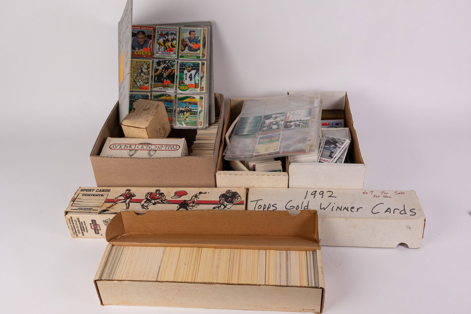Large Assortment of Sports Cards ft. 1992 Topps Winner Cards: This large assortment of sports cards features a plethora of trading cards from various teams of different sports. Size 7" X 12" x 12" Literature Brooks Auction – Online Auction Terms &