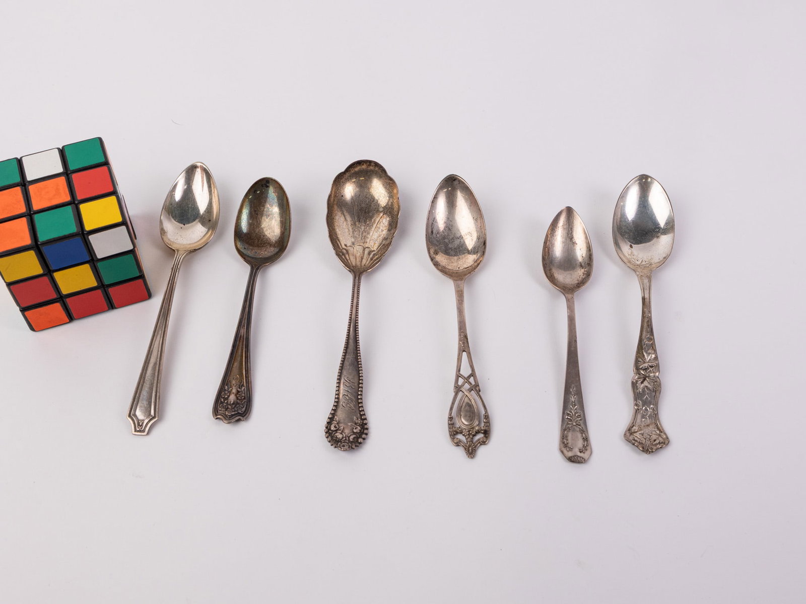 (6) Antique Sterling Silver Spoons: All marked "Sterling" with various hallmarks, Total weight is 116.3 grams Literature Brooks Auction – Online Auction Terms & Conditions Contact: (856) 694-2960 | info@brooks.auction READ BEFORE