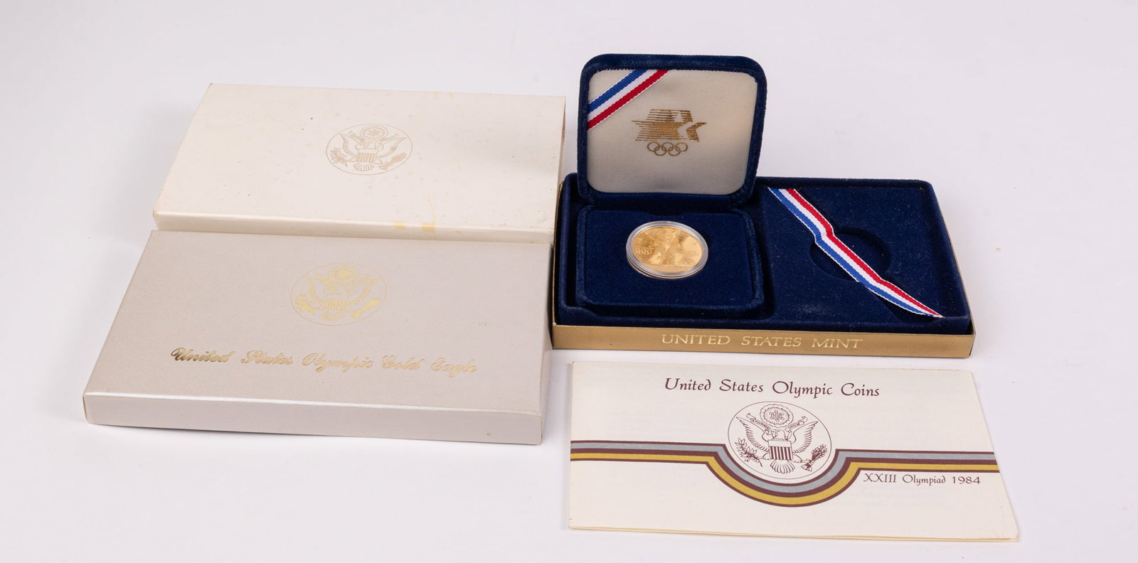 1984 Los Angeles Olympic $10 Gold Eagle Coin: Condition: Proof Date: 1984 Mint mark: "W" (West Point Bullion Depository) Diameter: 1.06 in. (27.00mm) -U.S. Gold Eagle Size Fineness: .900 Fine-21.6 karat Weight: .538 troy oz. (16.718g) Content: