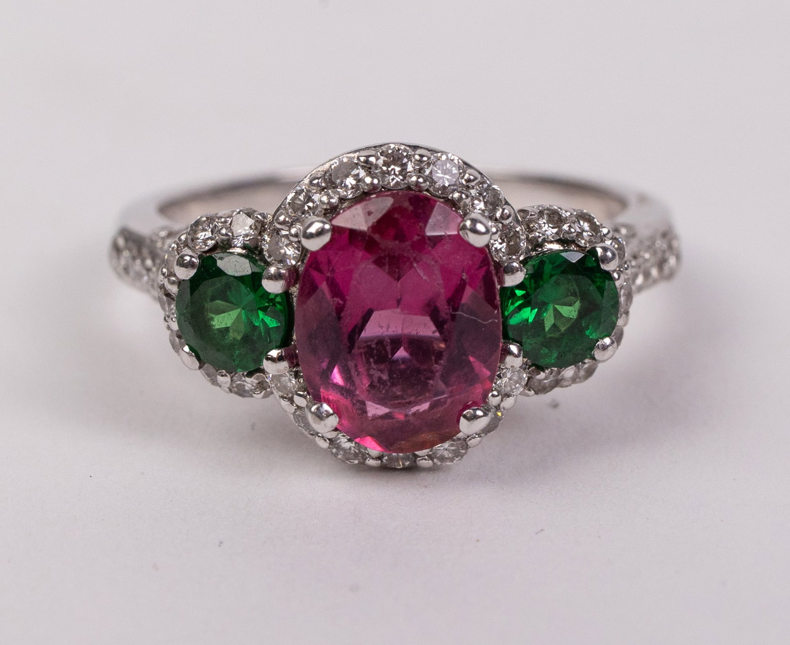 18KY Gold Tourmaline and Tsavorite Ring: Marked "18K", Total weight is 5.6 grams Literature Brooks Auction – Online Auction Terms & Conditions Contact: (856) 694-2960 | info@brooks.auction READ BEFORE YOU BID: We want you to feel