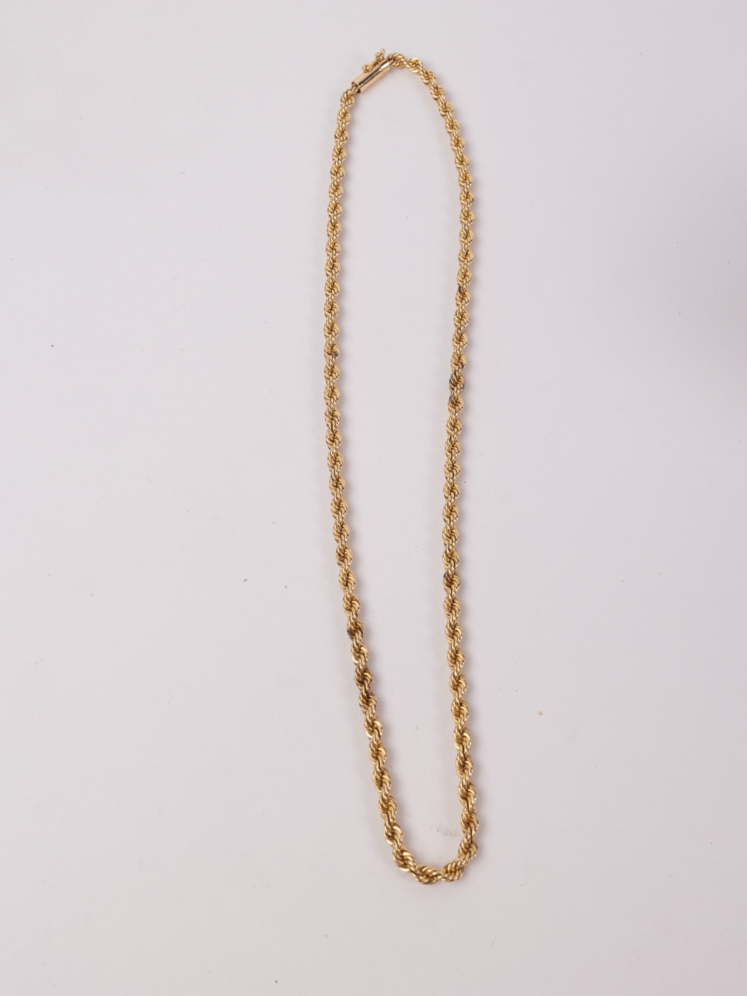 14KY Gold Twisted Rope Chain: Marked "14KT", Total weight 26.8 grams Literature Brooks Auction – Online Auction Terms & Conditions Contact: (856) 694-2960 | info@brooks.auction READ BEFORE YOU BID: We want you to feel