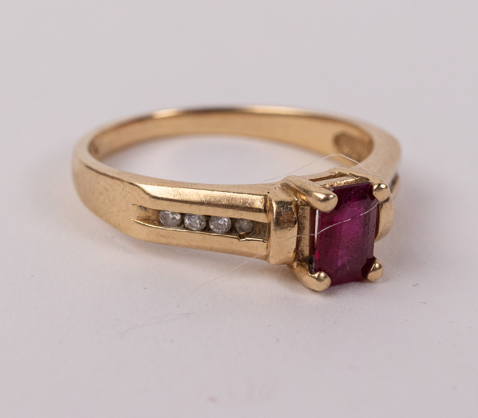 14KY Gold Ring with Rectangular-Cut Red Center Gemstone: Marked "JD 14K", Size 8, Total weight is 3.6 grams Literature Brooks Auction – Online Auction Terms & Conditions Contact: (856) 694-2960 | info@brooks.auction READ BEFORE YOU BID: We want you