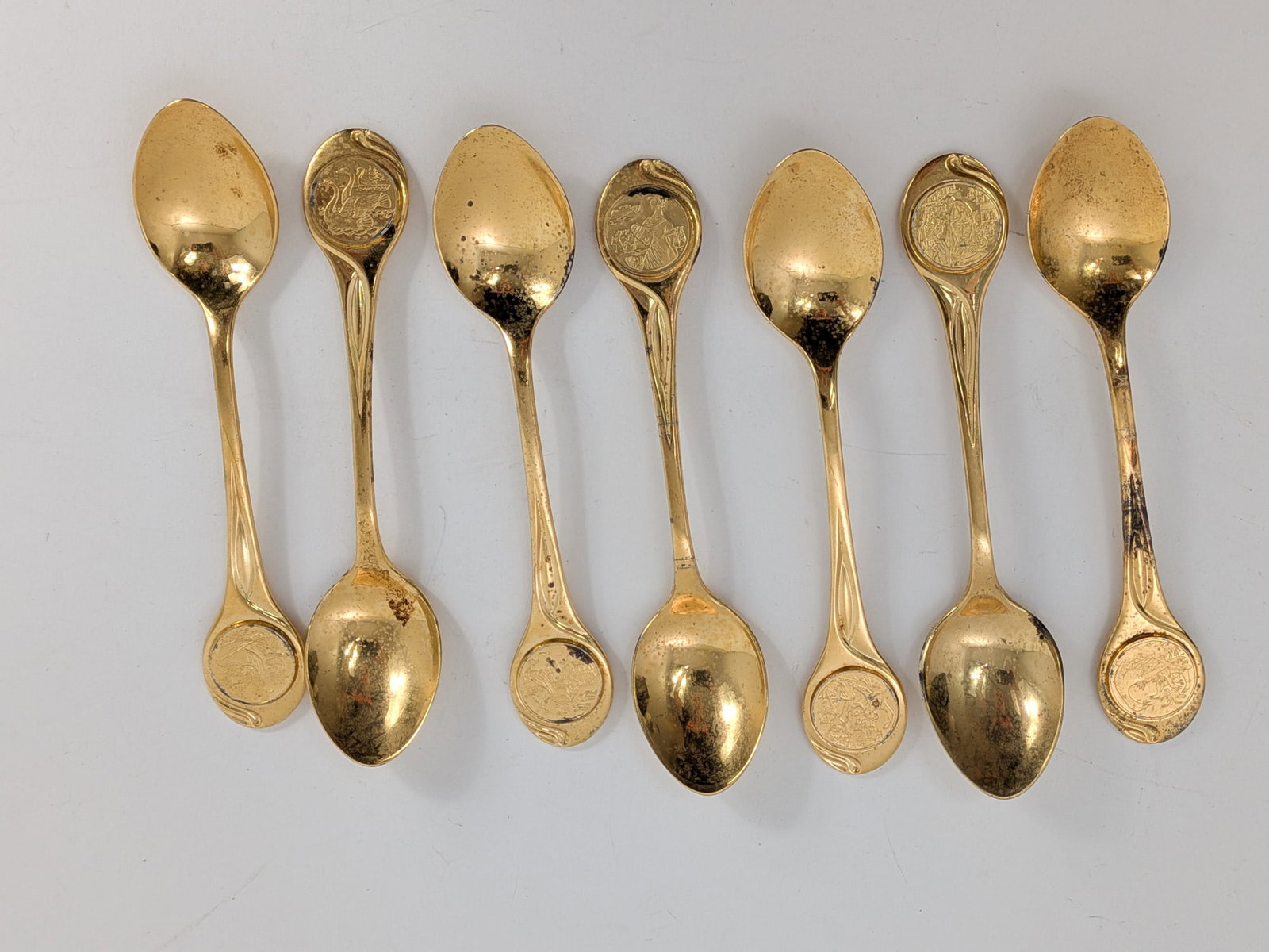 (7) Carlos Sierra-Franco Gold Vermeil Over Sterling Silver Spoons: Marked "Carlos Sierra-Franco Vermeil", Total weight is 210.3 grams Literature Brooks Auction – Online Auction Terms & Conditions Contact: (856) 694-2960 | info@brooks.auction READ BEFORE YOU