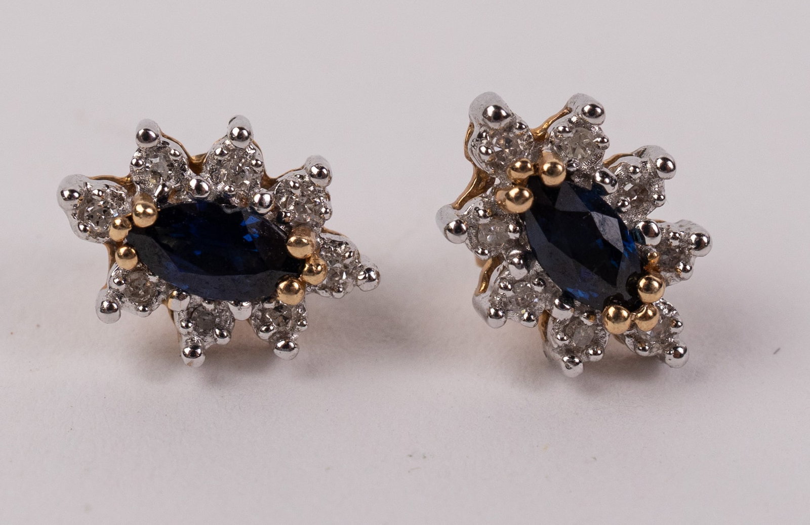 10KY Gold Pair of Marquise-Cut Halo Stud Earrings: Marked "10K", Total weight is 2.1 grams Literature Brooks Auction – Online Auction Terms & Conditions Contact: (856) 694-2960 | info@brooks.auction READ BEFORE YOU BID: We want you to feel