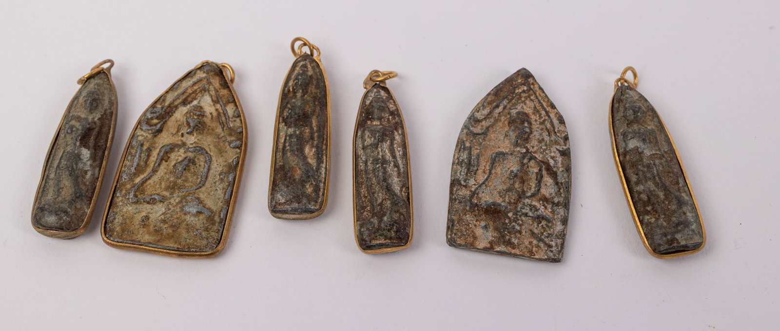 (6) Ancient Thai Bronze Buddhist Amulets: (6) Ancient Thai Bronze Buddhist Amulets Literature Brooks Auction – Online Auction Terms & Conditions Contact: (856) 694-2960 | info@brooks.auction READ BEFORE YOU BID: We want you to feel