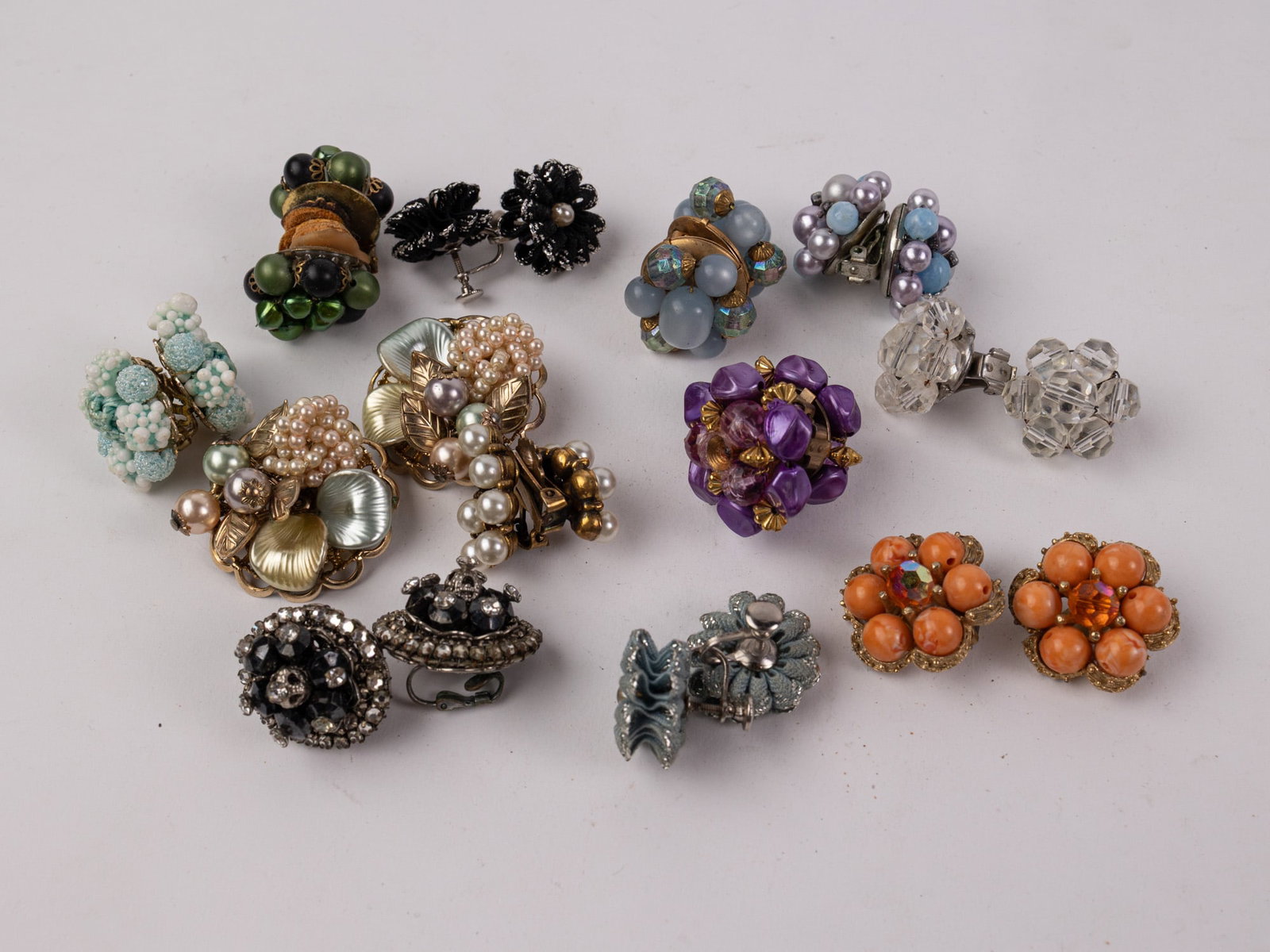 Assortment of Mid Century Clip-On and Screw-Back Earring Pairs: Assortment of Mid Century Clip-On and Screw-Back Earring Pairs Literature Brooks Auction – Online Auction Terms & Conditions Contact: (856) 694-2960 | info@brooks.auction READ BEFORE YOU BID:
