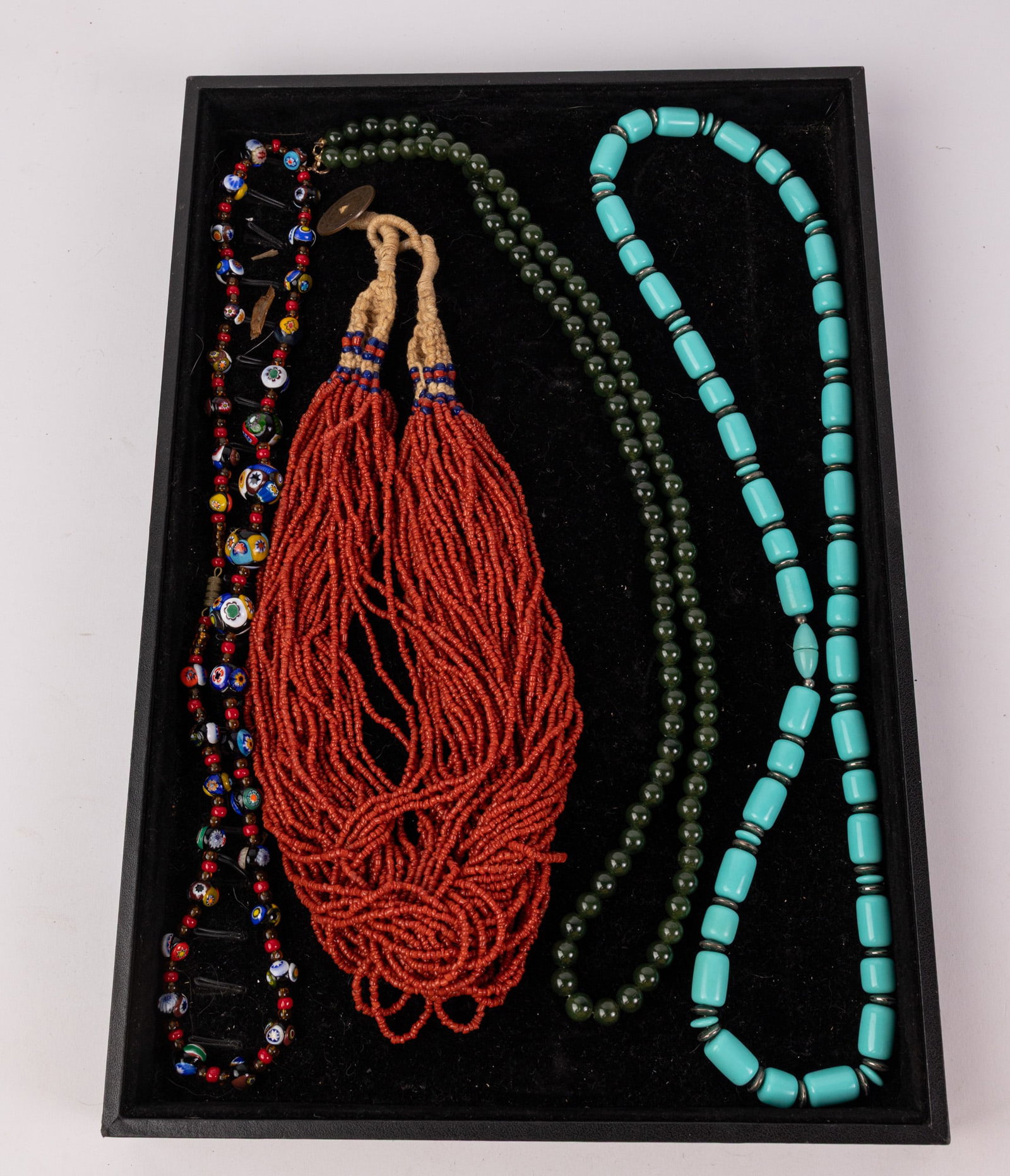 Four Vintage Necklaces Featuring Jade, Turquoise: Lot includes jade necklace with gold filled clasp, turquoise necklace, Czech glass necklace, and Southwestern beaded necklace with hemp chain. Literature Brooks Auction – Online Auction Terms &