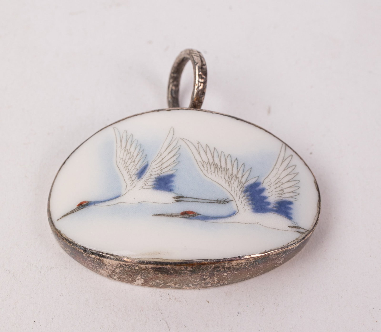 Vintage Sterling Pendant Featuring Pair of Flying Cranes: Vintage Sterling Pendant Featuring Pair of Flying Cranes Literature Brooks Auction – Online Auction Terms & Conditions Contact: (856) 694-2960 | info@brooks.auction READ BEFORE YOU BID: We want