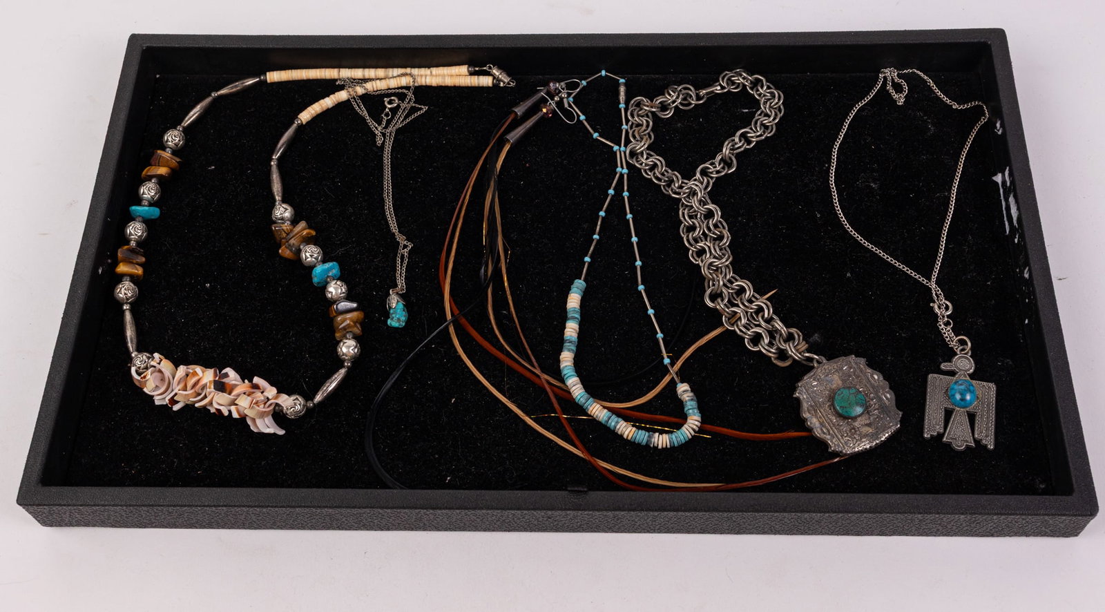Assortment of Native American-Style Jewelry: Assortment of Native American-Style Jewelry Literature Brooks Auction – Online Auction Terms & Conditions Contact: (856) 694-2960 | info@brooks.auction READ BEFORE YOU BID: We want you to feel