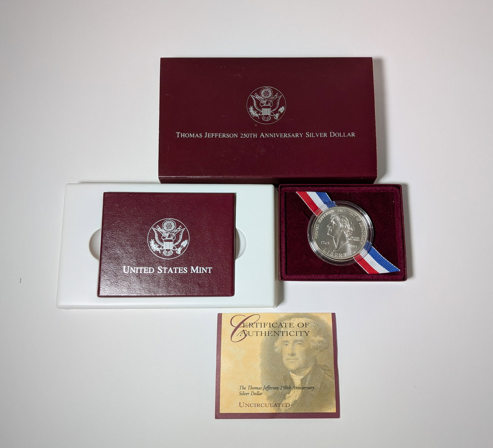 1993 Uncirculated Thomas Jefferson 250th Anniversary Silver Dollar: 1993 Uncirculated Thomas Jefferson 250th Anniversary Silver Dollar Literature Brooks Auction – Online Auction Terms & Conditions Contact: (856) 694-2960 | info@brooks.auction READ BEFORE YOU
