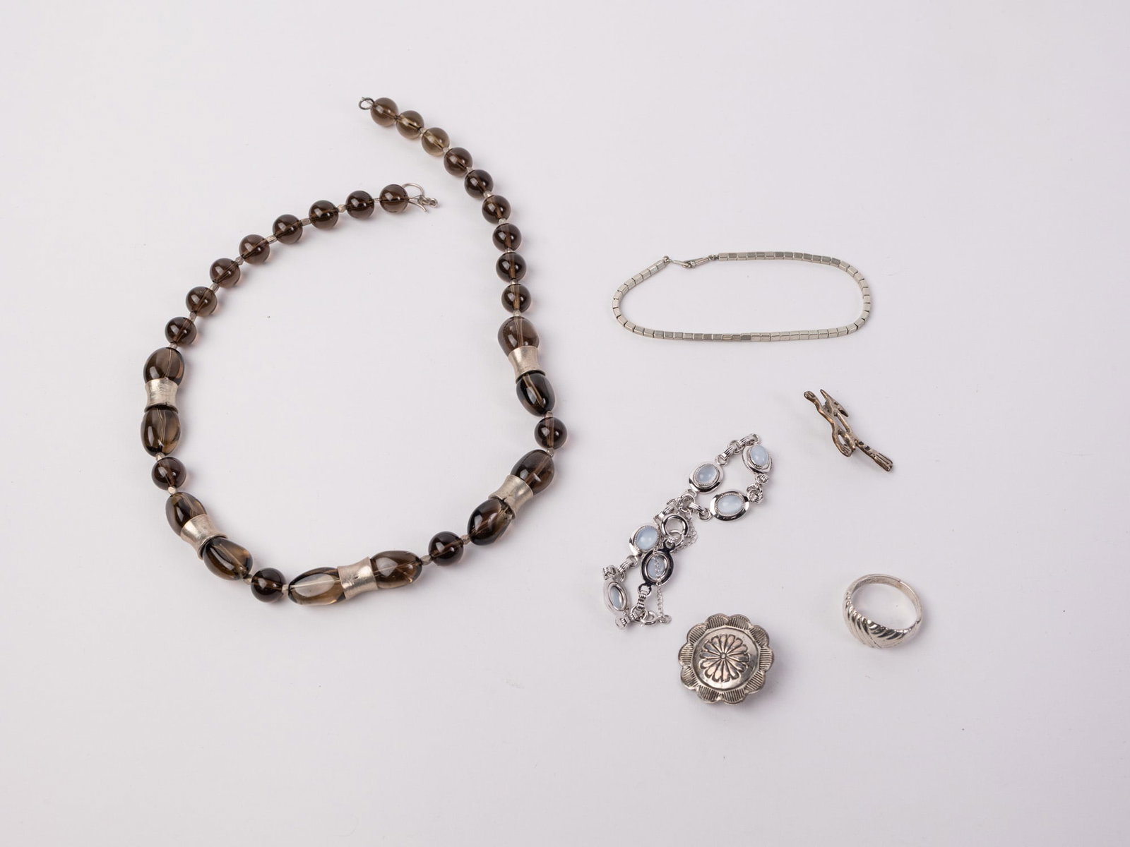 Grouping of Silver-Toned Jewelry ft. Gold Filled Bracelet: Grouping of Silver-Toned Jewelry ft. Gold Filled Bracelet Literature Brooks Auction – Online Auction Terms & Conditions Contact: (856) 694-2960 | info@brooks.auction READ BEFORE YOU BID: We