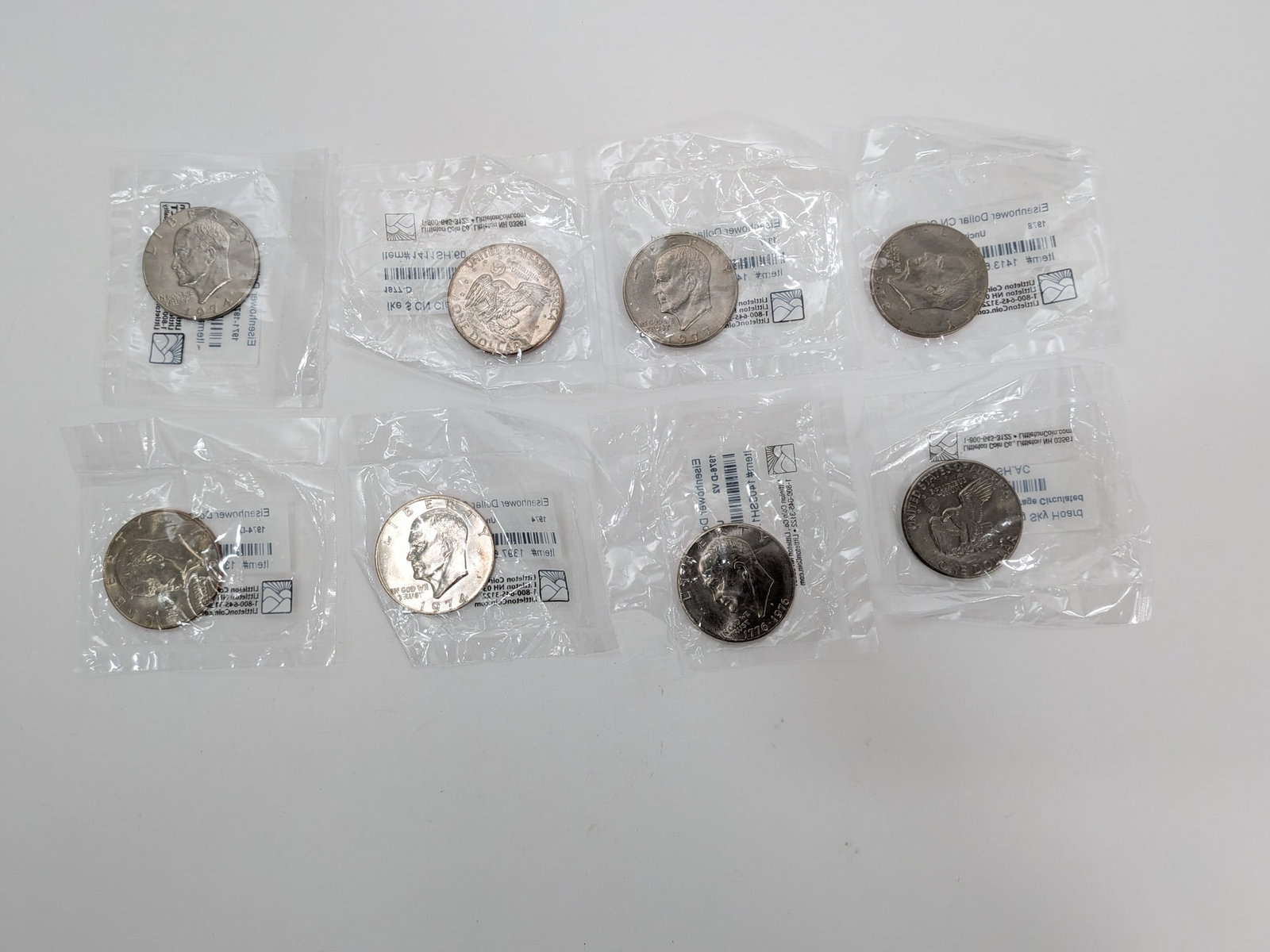Eight Uncirculated Eisenhower Dollars: Eight Uncirculated Eisenhower Dollars Literature Brooks Auction – Online Auction Terms & Conditions Contact: (856) 694-2960 | info@brooks.auction READ BEFORE YOU BID: We want you to feel