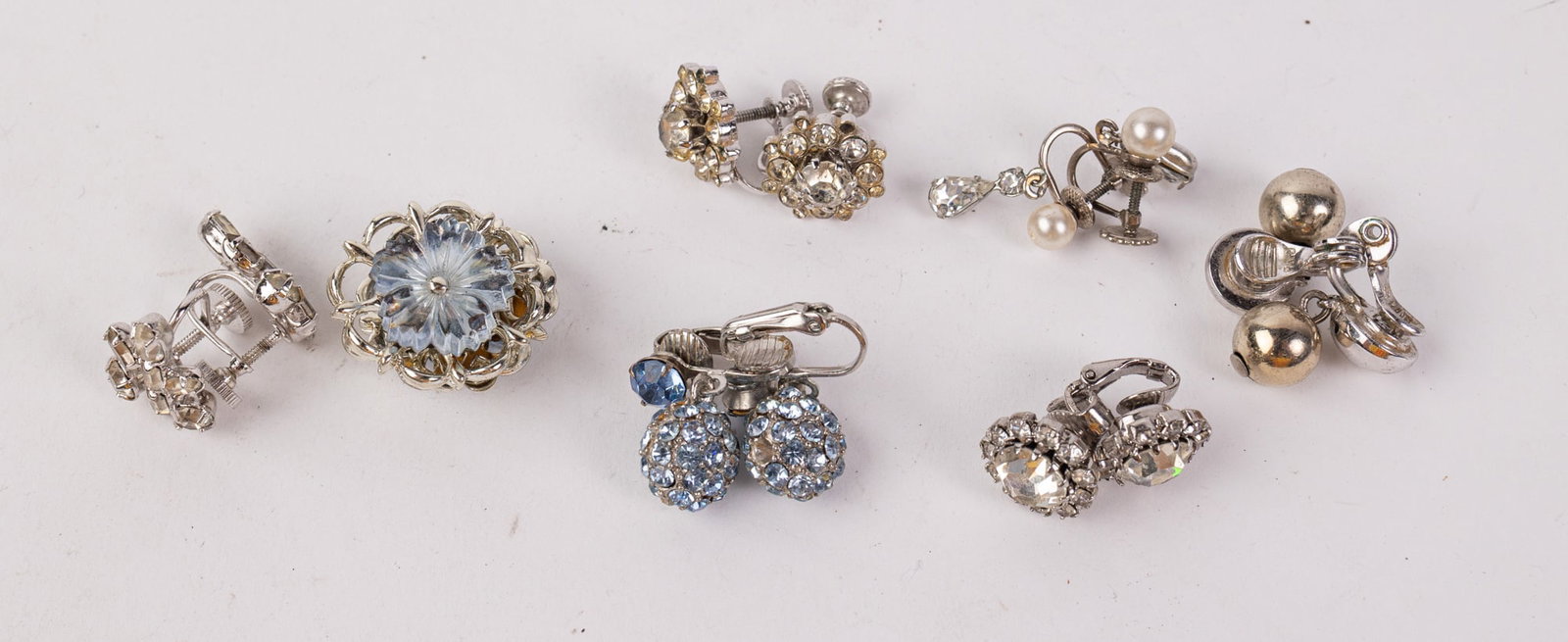 Assortment of Mid Century Clip-On and Screw-Back Earring Pairs: Assortment of Mid Century Clip-On and Screw-Back Earring Pairs Literature Brooks Auction – Online Auction Terms & Conditions Contact: (856) 694-2960 | info@brooks.auction READ BEFORE YOU BID: