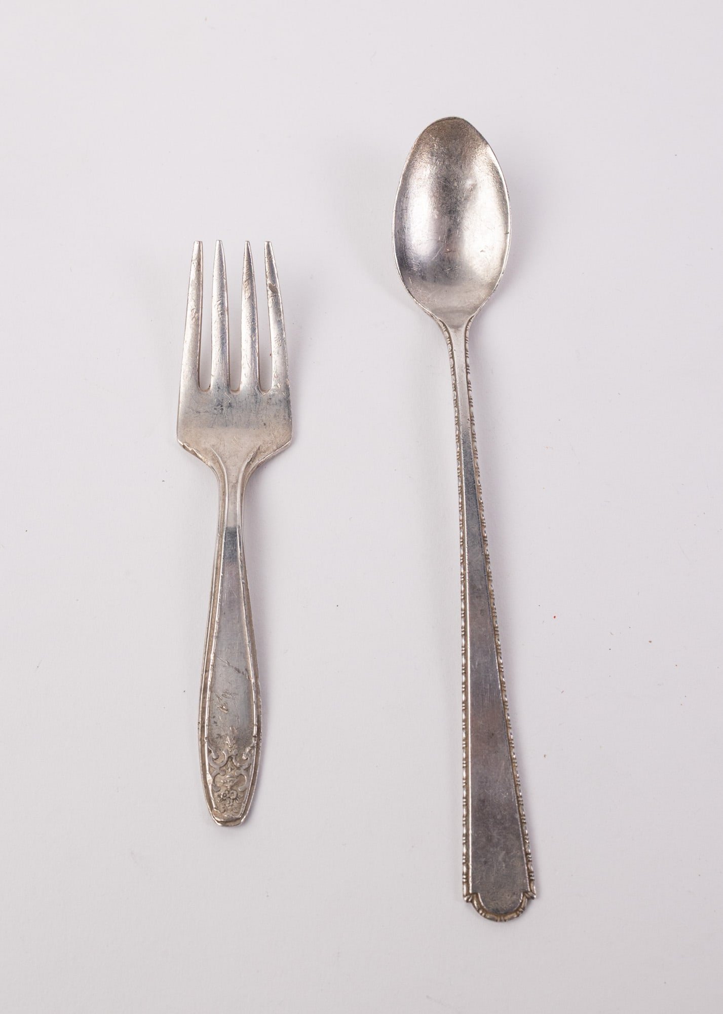 Pair of Vintage Sterling Silver Utensils: Fork and Spoon. Marked "Sterling", Total Weight is 32.7 grams Literature Brooks Auction – Online Auction Terms & Conditions Contact: (856) 694-2960 | info@brooks.auction READ BEFORE YOU BID: We