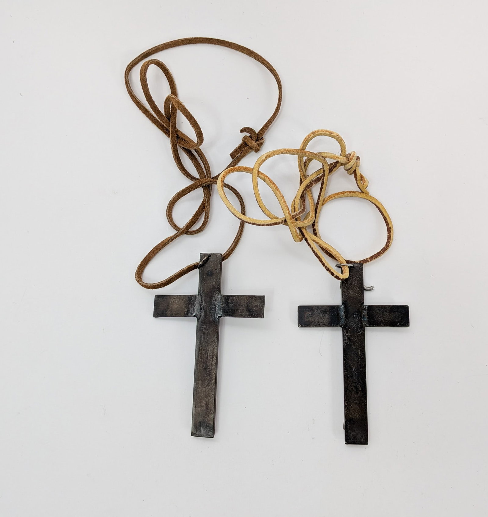 (2) Industrial Welded Crucifixes on Leather Necklaces: (2) Industrial Welded Crucifixes on Leather Necklaces Size 7" x 12" x 12" Literature Brooks Auction – Online Auction Terms & Conditions Contact: (856) 694-2960 | info@brooks.auction READ BEFORE