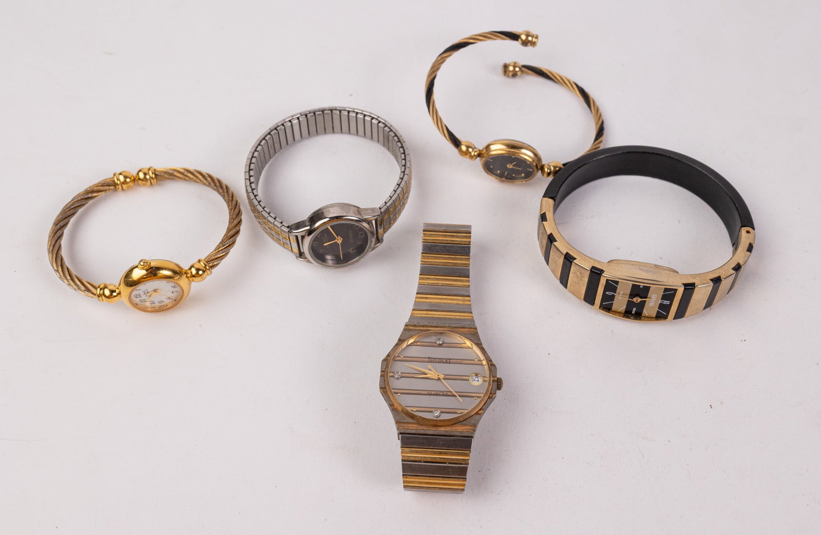 Assortment of Two-Tone Wrist Watches: Assortment of Two-Tone Wrist Watches Literature Brooks Auction – Online Auction Terms & Conditions Contact: (856) 694-2960 | info@brooks.auction READ BEFORE YOU BID: We want you to feel
