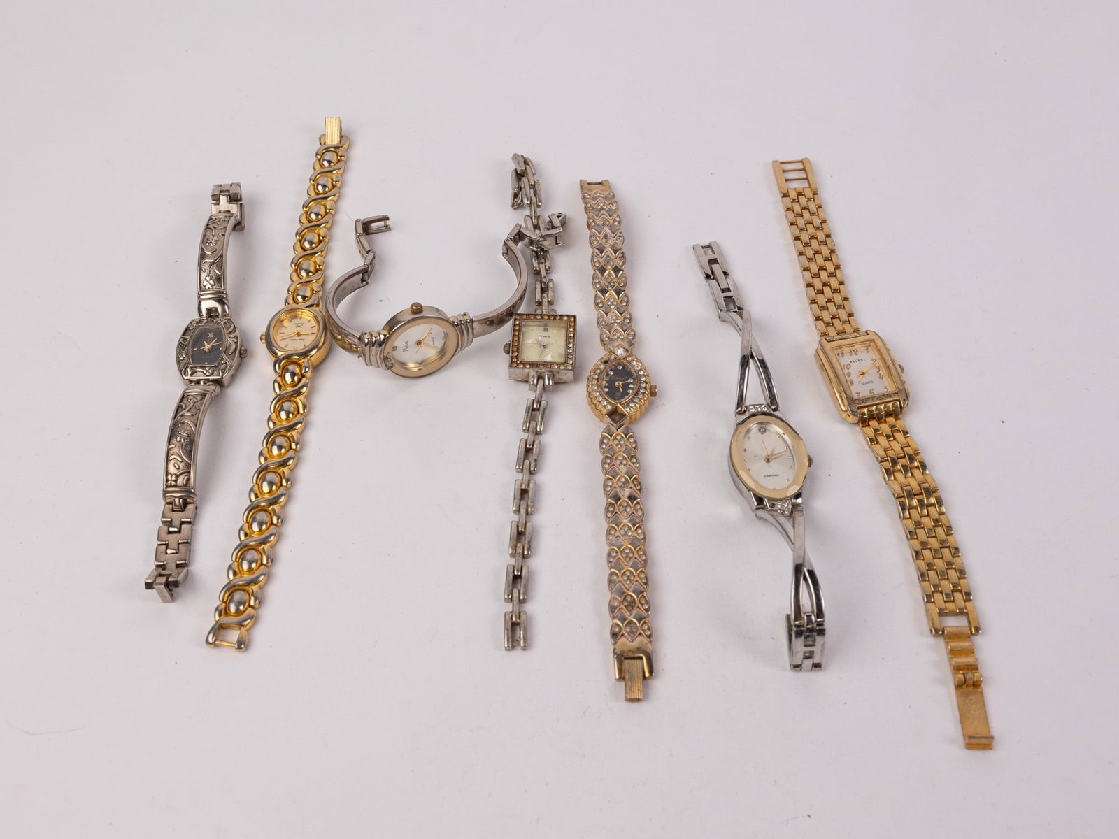 Assortment of Wrist Watches: Assortment of Wrist Watches Literature Brooks Auction – Online Auction Terms & Conditions Contact: (856) 694-2960 | info@brooks.auction READ BEFORE YOU BID: We want you to feel confident when