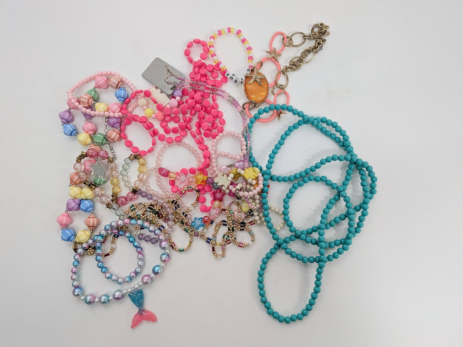 Grouping of Pink Y2K Costume Jewelry: Grouping of Pink Y2K Costume Jewelry Size 7" x 12" x 12" Literature Brooks Auction – Online Auction Terms & Conditions Contact: (856) 694-2960 | info@brooks.auction READ BEFORE YOU BID: We want