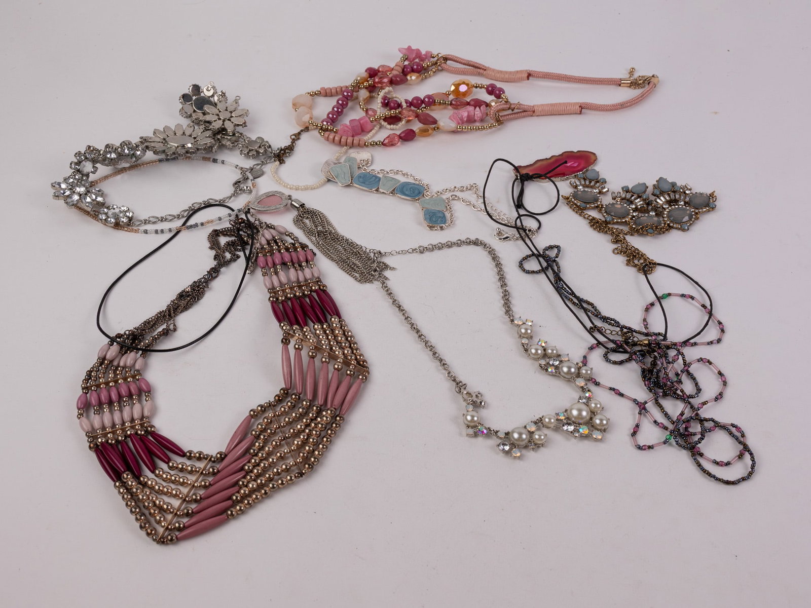 Assortment of Costume Jewelry: Assortment of Costume Jewelry Size 7" x 12" x 12" Literature Brooks Auction – Online Auction Terms & Conditions Contact: (856) 694-2960 | info@brooks.auction READ BEFORE YOU BID: We want you to