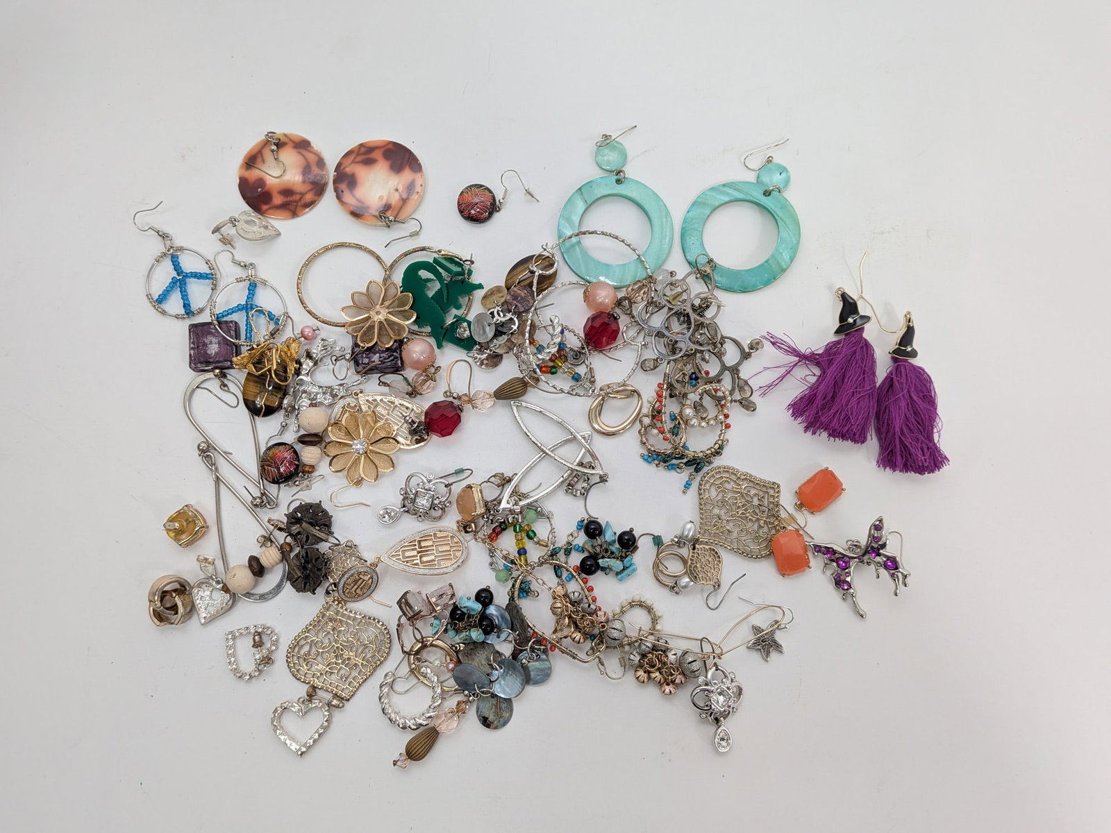 Assortment of Pairs of Earrings: Assortment of Pairs of Earrings Size 7" x 12" x 12" Literature Brooks Auction – Online Auction Terms & Conditions Contact: (856) 694-2960 | info@brooks.auction READ BEFORE YOU BID: We want you
