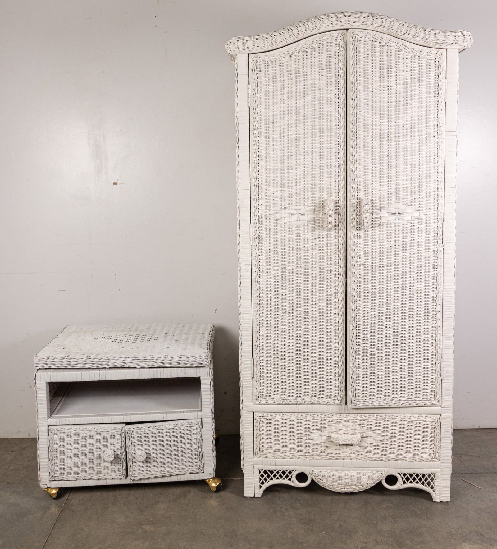 Vintage White Wicker Armoire & Rolling Nightstand: Transform your bedroom into a dreamy bohemian oasis with this gorgeous matching white wicker set featuring a beautiful armoire and a rolling nightstand. Size 70" x 33" x 21" Literature Brooks Auction