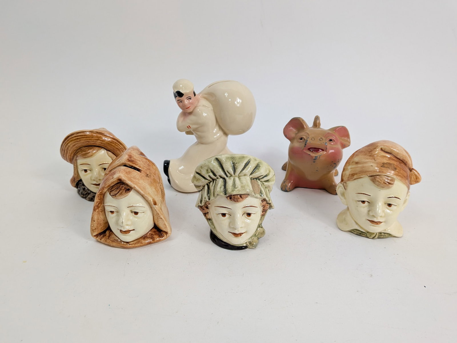 Assortment of Ceramic Coin Banks: Assortment of Ceramic Coin Banks Size 7" x 12" x 12" Literature Brooks Auction – Online Auction Terms & Conditions
