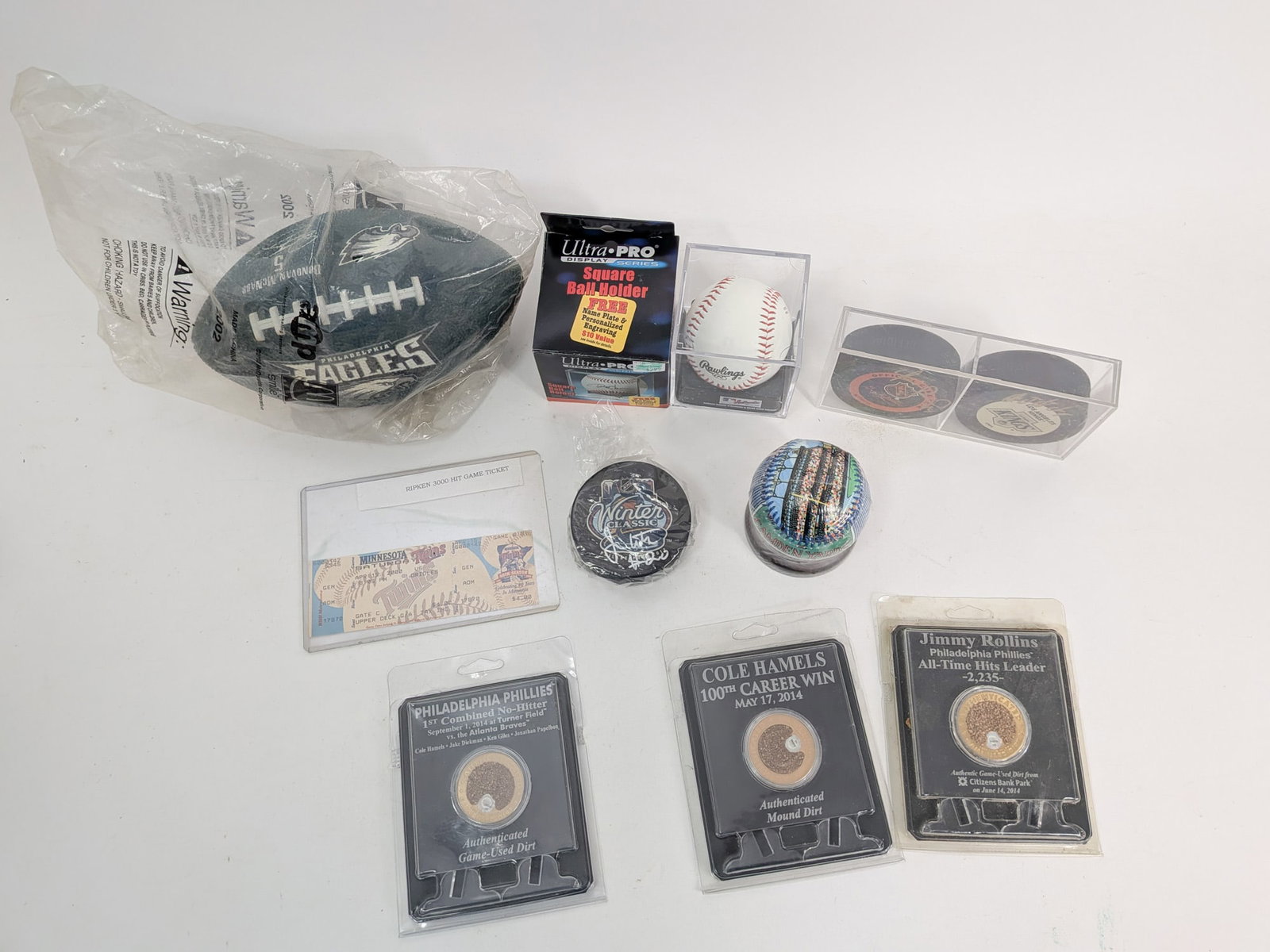 Assortment of Sports Memorabilia ft. Pucks with Signatures - 2